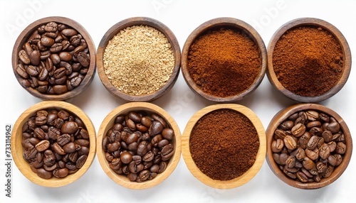 flat lay of different types of grinds coffee in wooden bowl isolated on white background clipping path