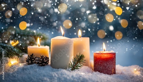 christmas card merry christmas and happy new year 2023 three burning candles in snow with magic bokeh lights