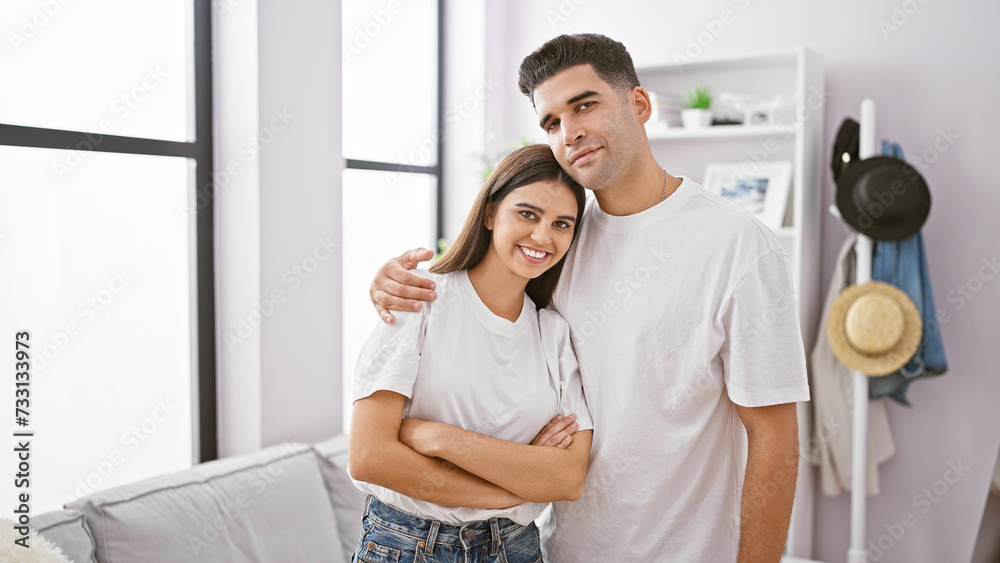 Couple embracing in a modern living room showcasing their love and companionship in a comfortable home environment. Couple embracing in a modern living room showcasing their love and companionship in a comfortable home environment.