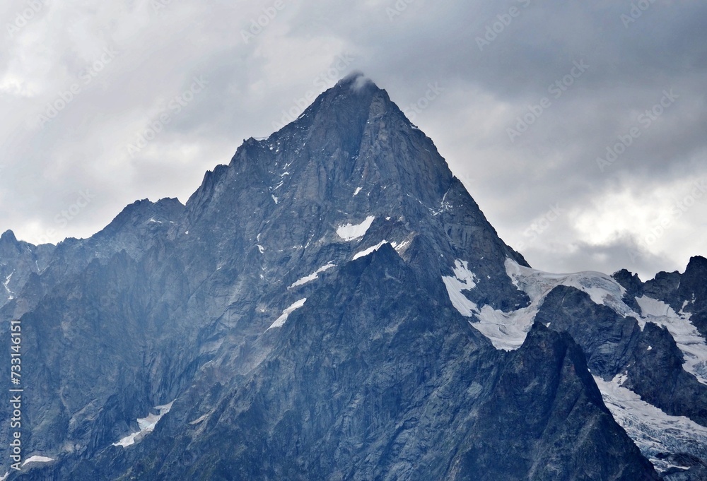 the cloudy summit of Grandes Jorasses, italian alps, Tour du Mont Blanc