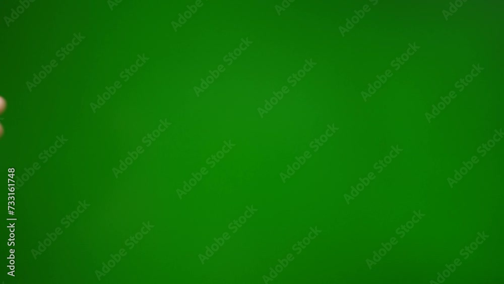 Fingers grab and raise on a green background. Fingers grab and raise on a green background.