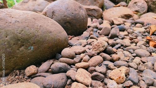 Pebble texture or gravel background for design. Real grunge texture background and small stones. Top view of dirt gravel road.