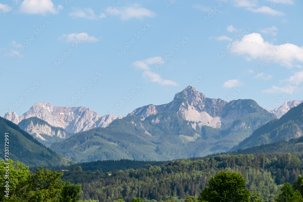 Scenic view of majestic mountain peaks of Karawanks seen from Feistritz im Rosental, Carinthia, Austria. Majestic Wertatscha and Kosiak summit in summer. Hiking in alpine wilderness Austrian Alps