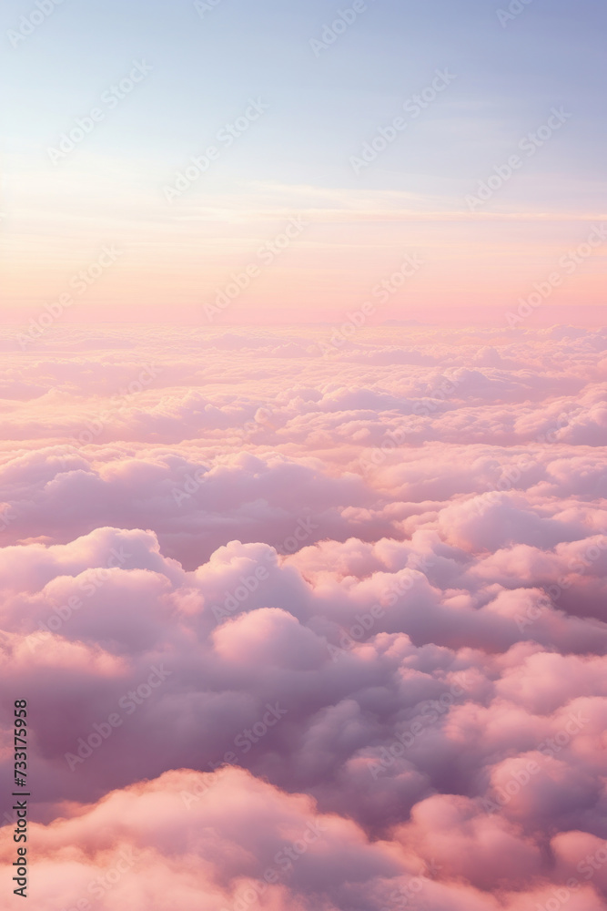 Aerial view of Beautiful sunrise sky above clouds or fog with dramatic light at dawn.