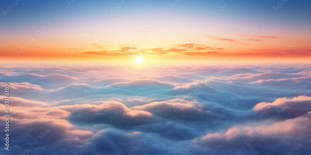 Aerial view of Beautiful sunrise sky above clouds or fog with dramatic light at dawn.