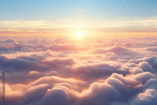 Aerial view of Beautiful sunrise sky above clouds or fog with dramatic light at dawn.