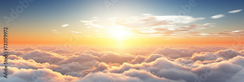 Beautiful sunrise sky above clouds with dramatic light in the morning. © Wararat