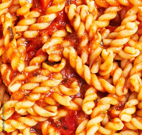 Close-up of delicious homemade pasta fusilli with tomato sauce, highlighting italian cuisine