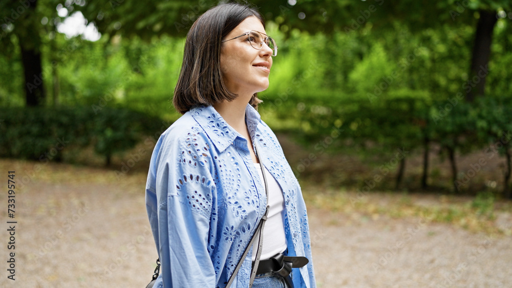Young beautiful hispanic woman walking smiling at the park in Vienna Young beautiful hispanic woman walking smiling at the park in Vienna