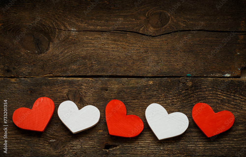 Red and white hearts on old wooden background Red and white hearts on old wooden background