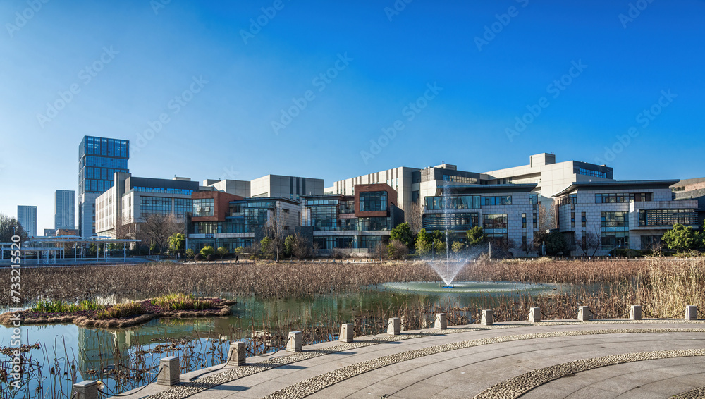Clear Sky Over Urban Park and City Buildings