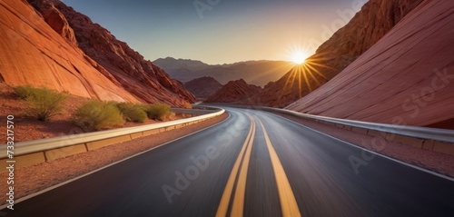 the sun shines brightly on the road in the valley of fire state park near las vegas, nv. photo