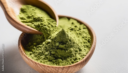 A wooden bowl filled with green powder