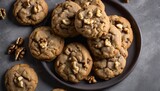 A plate of cookies with walnuts on top