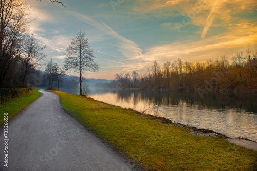 Cycle path along the river at sunset