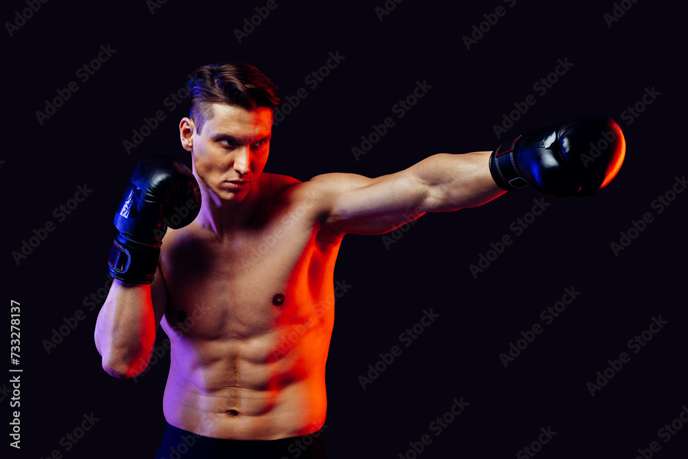 Athletic man with fit muscular body training in studio Athletic man with fit muscular body training in studio