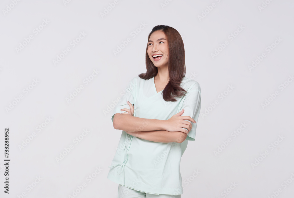 Happy asian woman patient arms crossed and looking up isolated on white studio background. life insurance and coverage concept. Happy asian woman patient arms crossed and looking up isolated on white studio background. life insurance and coverage concept.