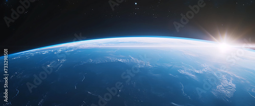 a blue earth seen from space and with a bright light 