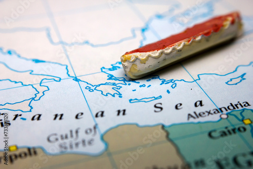 A boat and a map of Europe representing the immigration over sea