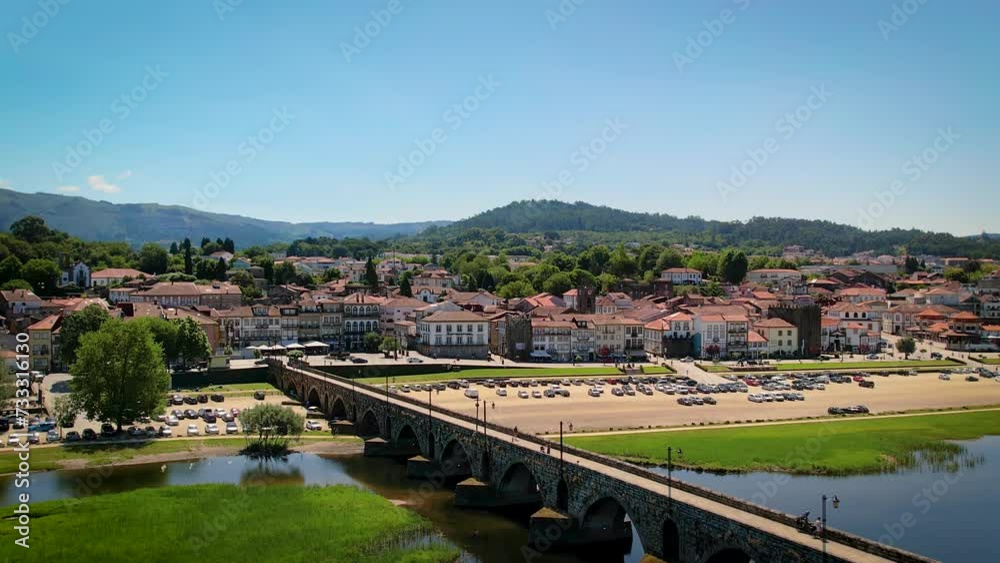 Ponte de Lima town center with the Romanic bridge on the foreground - Aerial establishing shot Ponte de Lima town center with the Romanic bridge on the foreground - Aerial establishing shot