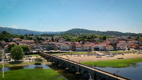 Ponte de Lima town center with the Romanic bridge on the foreground - Aerial establishing shot photo