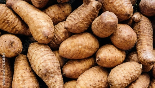 A pile of sweet potatoes on display photo