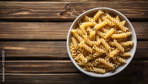 A bowl of pasta on a wooden table