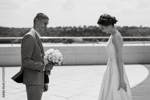 bride and groom first meeting on the roof of skyscraper