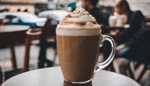 A cup of coffee with whipped cream on top