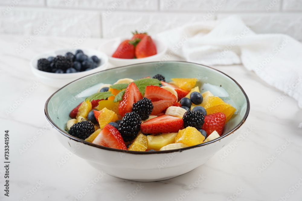 Summer Fruit salad with oranges, strawberries, blueberries, blackberries and fresh mint. Healthy food Summer Fruit salad with oranges, strawberries, blueberries, blackberries and fresh mint. Healthy food