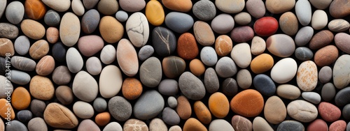 Neatly arranged pebbles of various sizes and hues. rock  gravel  pebble texture pattern gravel full frame stone background