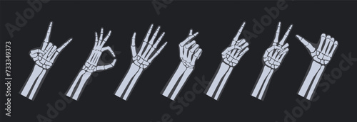 Skeletal hand x-ray gestures. Peace sign, okay and love heart gesture, rock horns and thumbs up like vector illustration set photo