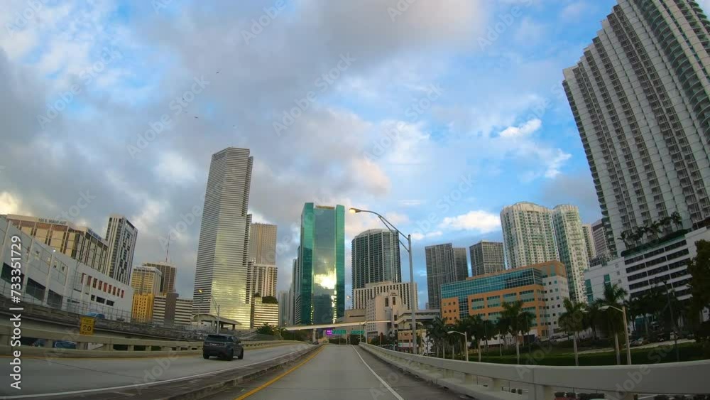 Driving in downtown Miami under a cloudy sky. Florida, USA Driving in downtown Miami under a cloudy sky. Florida, USA