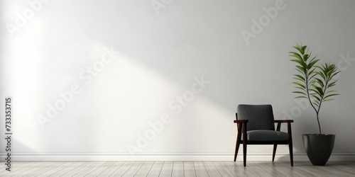 Black chair in the interior of a room with a white wall photo