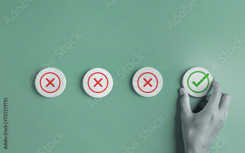 approval, approved, check, checkmark, choice, choose, confirm, correct, cross, decision. use finger to select green correct mark put on round wooden chip, the concept of choice without people.