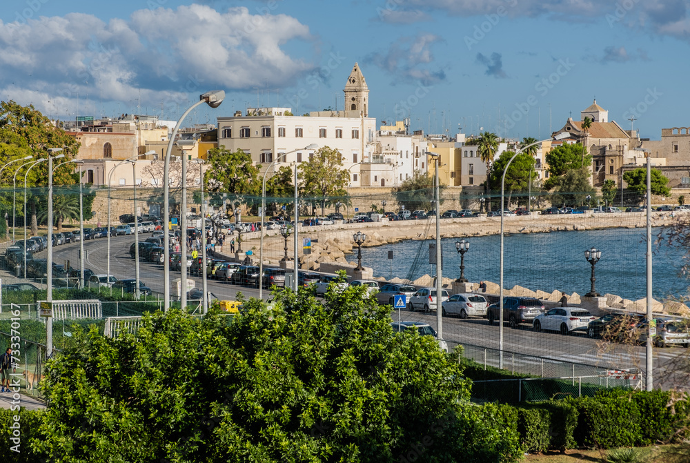 Waterfront of Lungomare Imperatore Augusto street in Bari with harbour in the background. Bari, Puglia region (Apulia), southern Italy, Europe, September 18, 2022