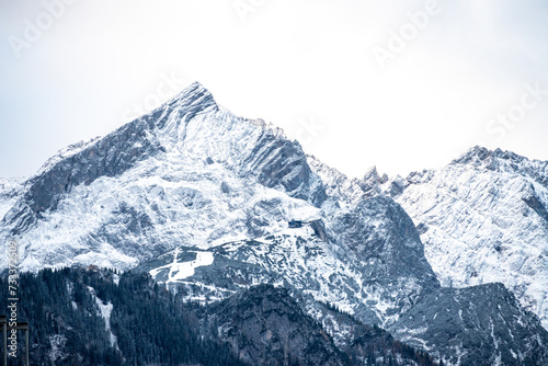 Snow-Covered Mountain Peaks Against a Cloudy Sky © GPH-Foto.de