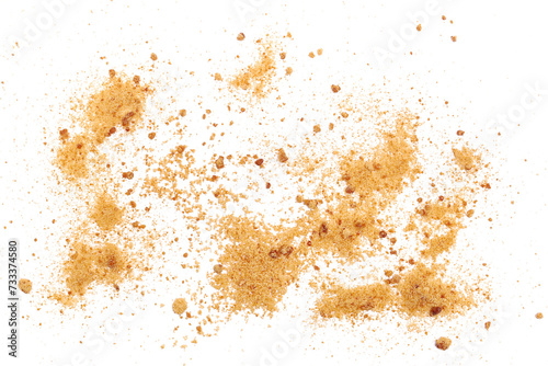 Close up unrefined brown cane sugar, scatter isolated on white, macro 
