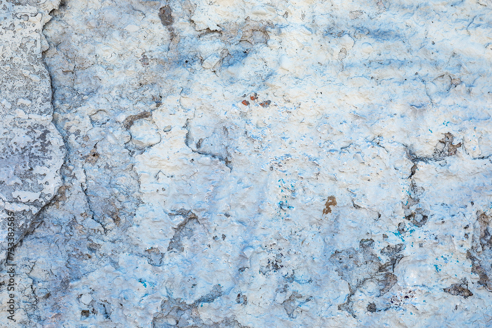 Winter color old plastered concrete wall with cracked and fallen paint, texture for background Winter color old plastered concrete wall with cracked and fallen paint, texture for background