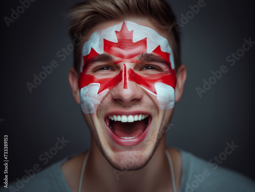 Euphoric National CANADA Team Fan with painted country flag colors face excited Roaring Supporting songs their favorite team straight at camera. Active sport fans movement and human emotion