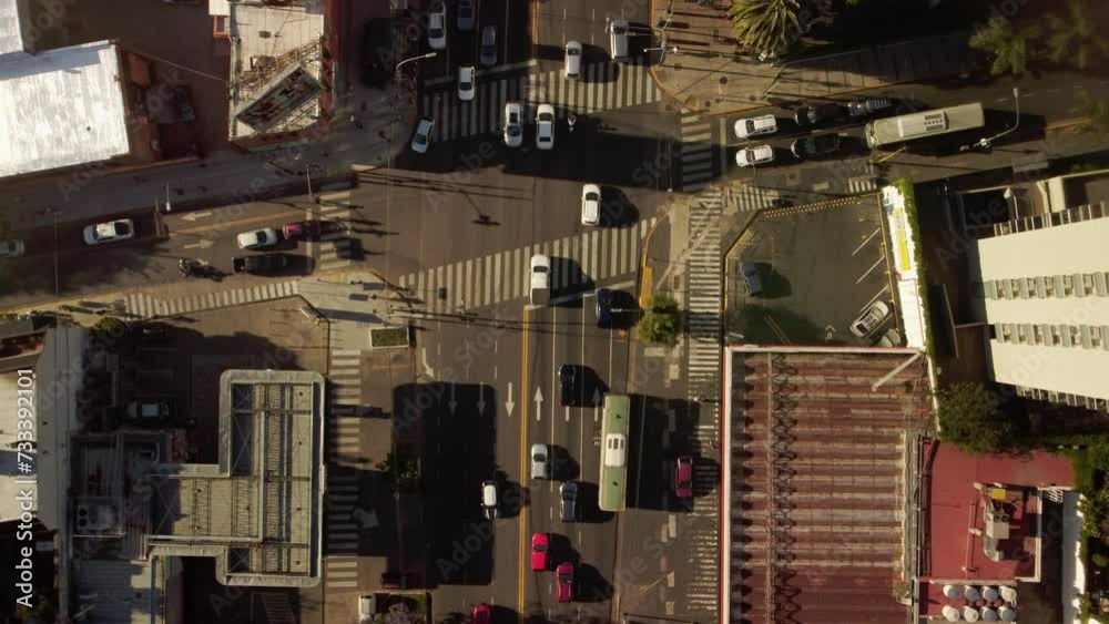 Cars traffic at crossroads. Auto road transport in city, top aerial view. Cars traffic at crossroads. Auto road transport in city, top aerial view.