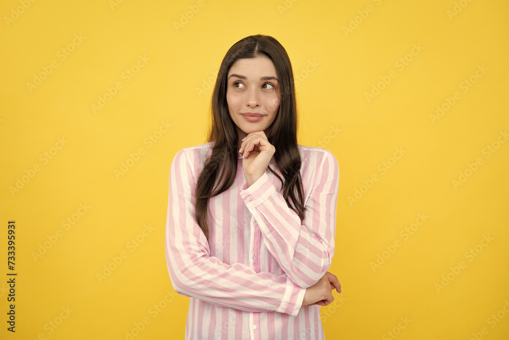 Portrait of young woman thinking, looking up empty space. Thoughtful serious model in studio looking away. Girl thought choose decide solve problems. Portrait of young woman thinking, looking up empty space. Thoughtful serious model in studio looking away. Girl thought choose decide solve problems.