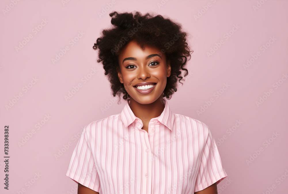 Fototapeta premium African young beautiful woman posing and smiling. pink background.