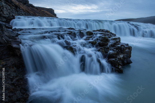 Detail of a dreamy dark Gullfoss waterfall with blurred water in Iceland photo