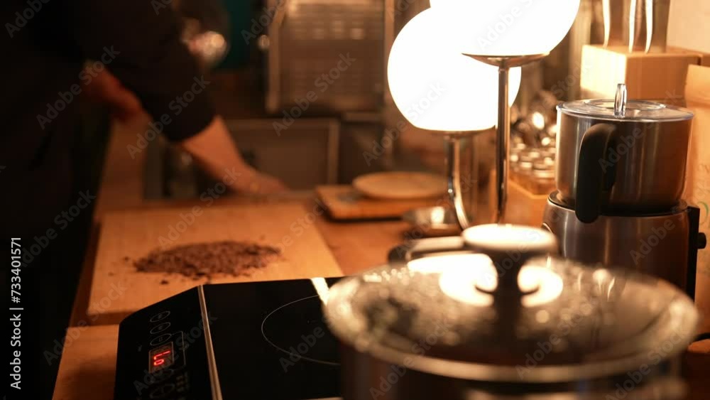 Cocoa making process on the wooden table in a cozy kitchen with a mood lighting. Chef Preparing cocoa drink. High-quality footage closeup cinematic 4k 10 bit. Pouring cocoa into cup. Cocoa making process on the wooden table in a cozy kitchen with a mood lighting. Chef Preparing cocoa drink. High-quality footage closeup cinematic 4k 10 bit. Pouring cocoa into cup.