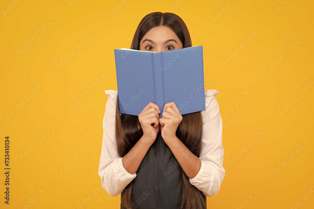 Schoolgirl with copy book posing on isolated background. Literature lesson, grammar school. Intellectual child reader. Schoolgirl with copy book posing on isolated background. Literature lesson, grammar school. Intellectual child reader.