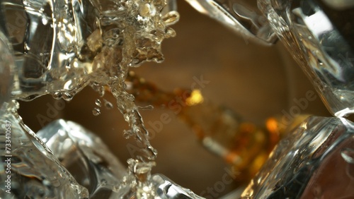 Pouring Whiskey into Glass, Macro Shot.