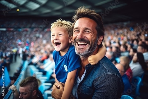 French father and son in stands, passionately supporting national sports team in blue attire photo
