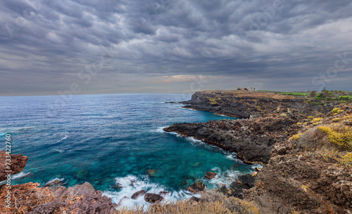 Panoramic view of the coast of the island of Tenerife against a stormy sky..