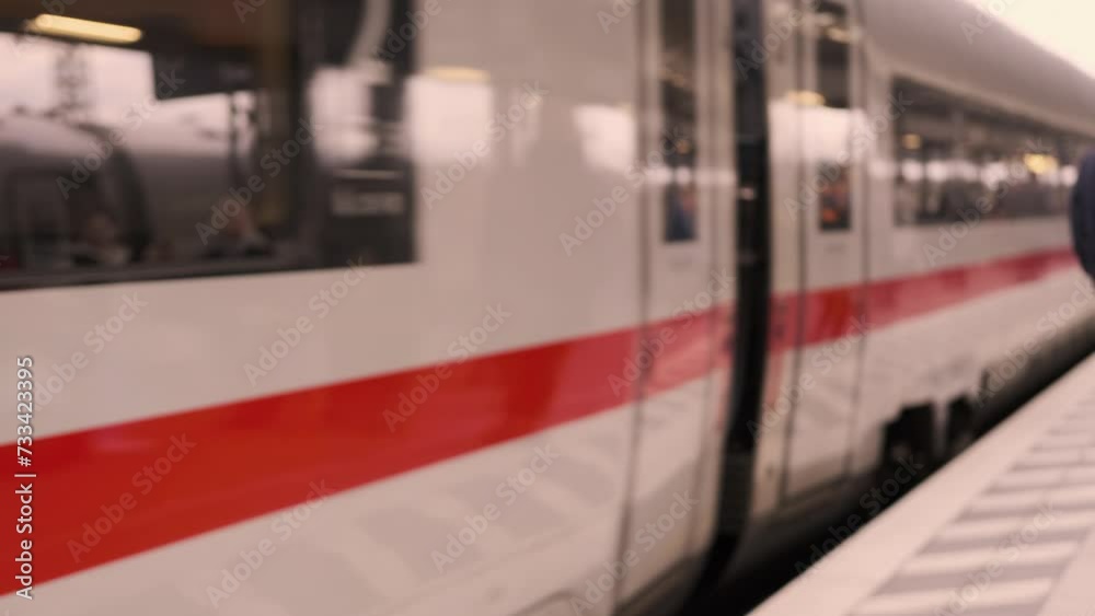 passengers late, running to German railway train, platform Frankfurt am Main station, out of focus video, people with luggage and backpack boarding travelers in cars, Frankfurt - January 31, 2024